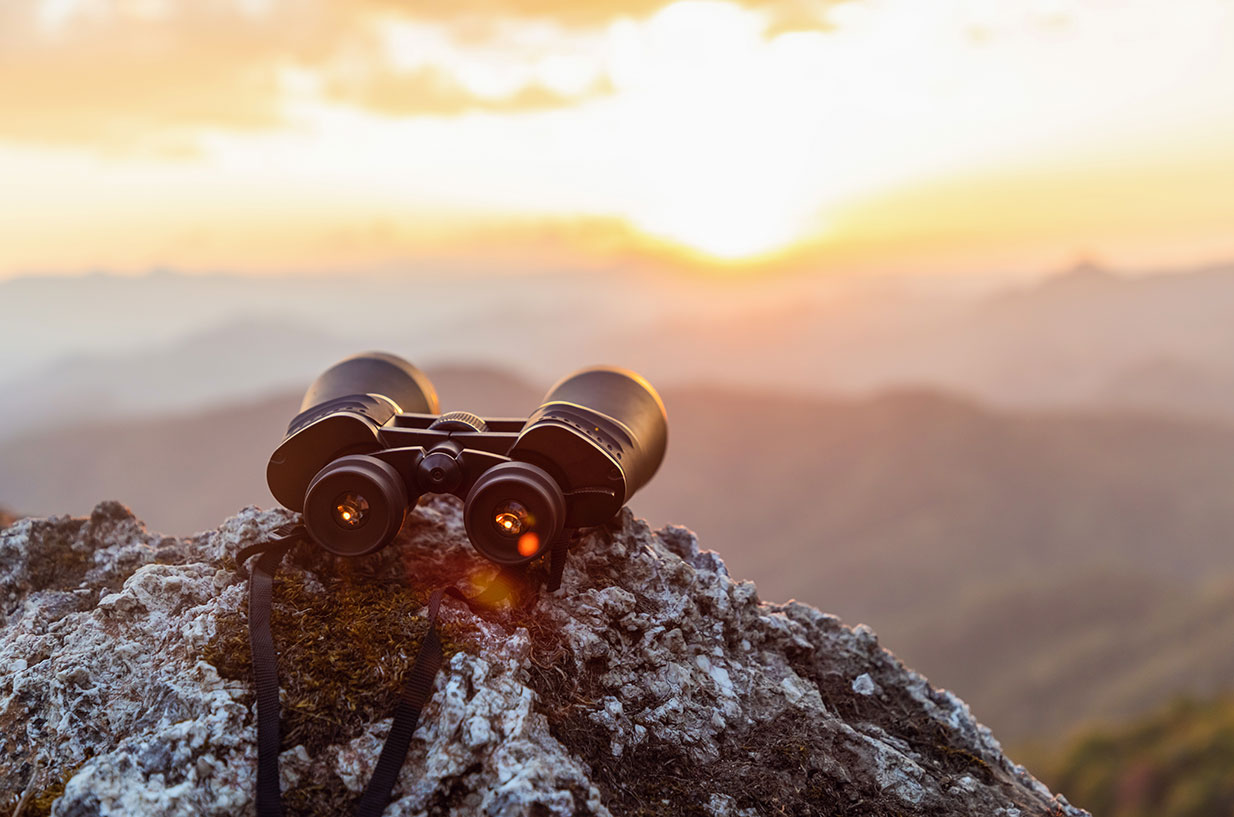 Binoculars sitting on a mountain top